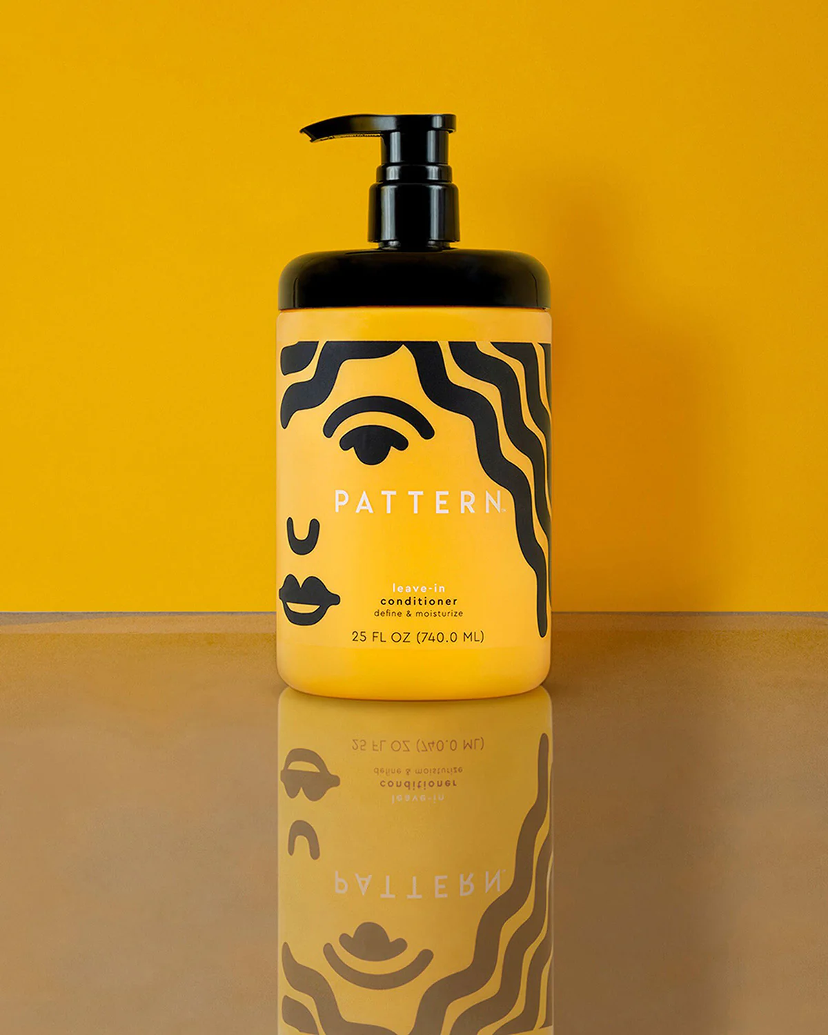 Pattern Beauty Leave-In Conditioner bottle on yellow background